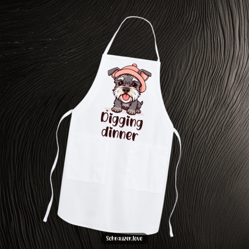 Funny apron showing a schnauzer wearing a small hat, digging enthusiastically, adding humor to kitchen tasks.