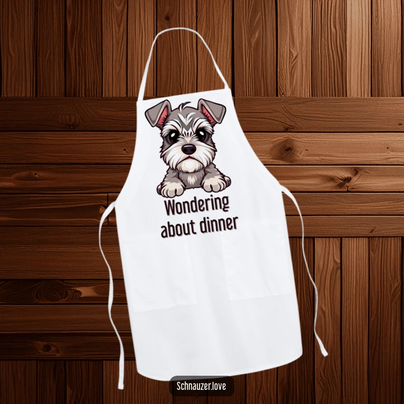 Funny Apron depicting a cute schnauzer with prominent eyebrows, tilting its head with a curious expression, perfect for the kitchen.