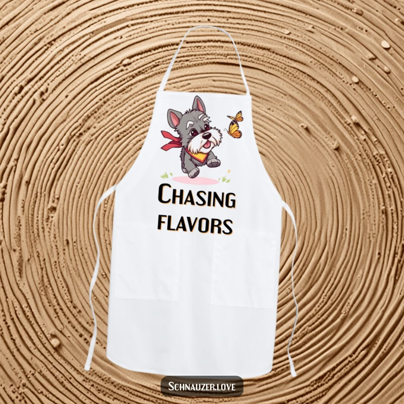 Funny apron showing a schnauzer wearing a bandana, enthusiastically chasing a butterfly, adding humor to kitchen tasks.