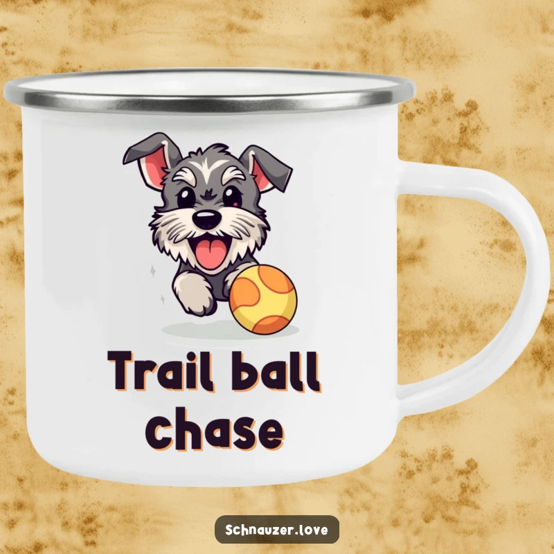 Funny schnauzer camping mug, a sturdy enamel mug with a happy dog with its tongue out, chasing a bouncy ball, ready for outdoor fun.