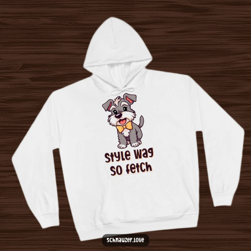 Funny Schnauzer Hoodie: A schnauzer in a bow, joyfully wagging its tail, offering warmth and humor for screen readers.