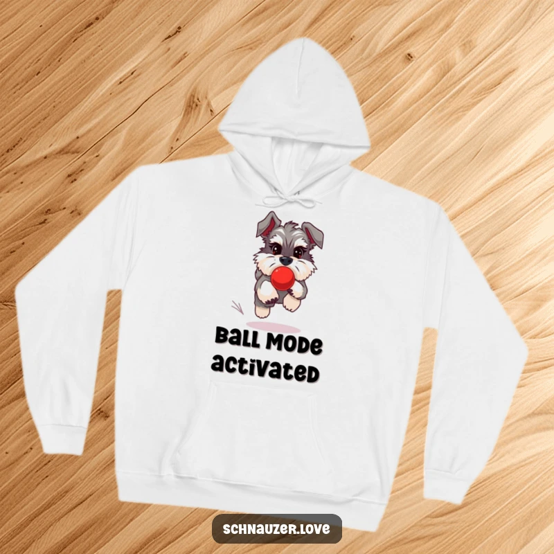 Funny Schnauzer Hoodie showing a fluffy schnauzer in pursuit of a bouncing red ball, ideal for cozy, active wear.