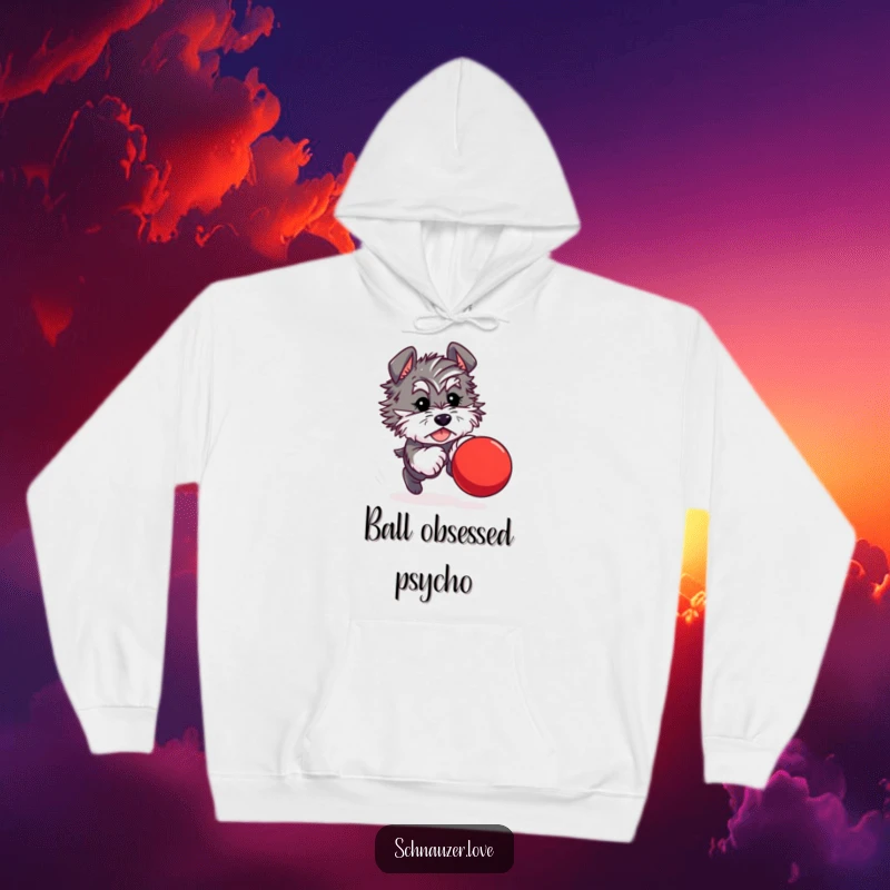 Funny hoodie print of a fluffy schnauzer character in full pursuit of a bouncing red ball, radiating playful excitement.