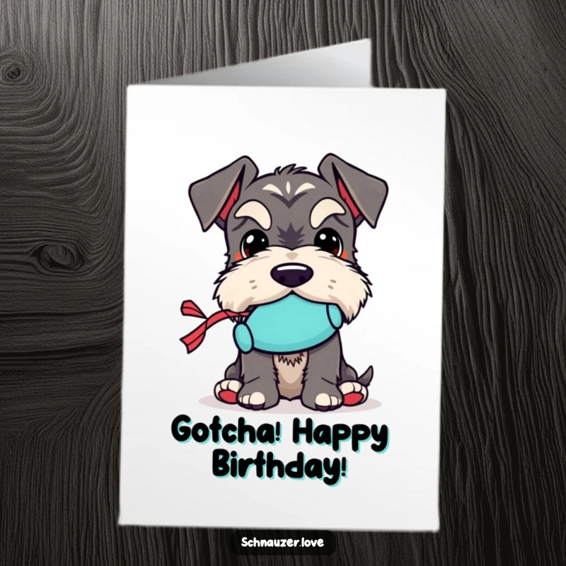 Funny Free Printable Birthday Card: Schnauzer holding a tiny squeaky toy, ready for birthday play.