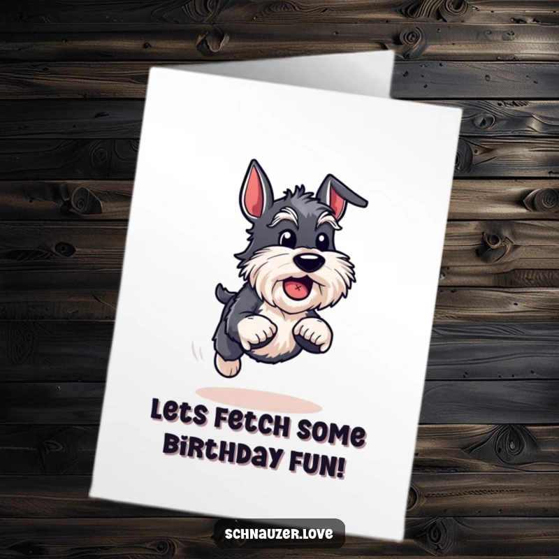 Funny Free Printable Birthday Card: An energetic schnauzer bounds with joy, ball in mouth, celebrating their birthday. Pure fun!
