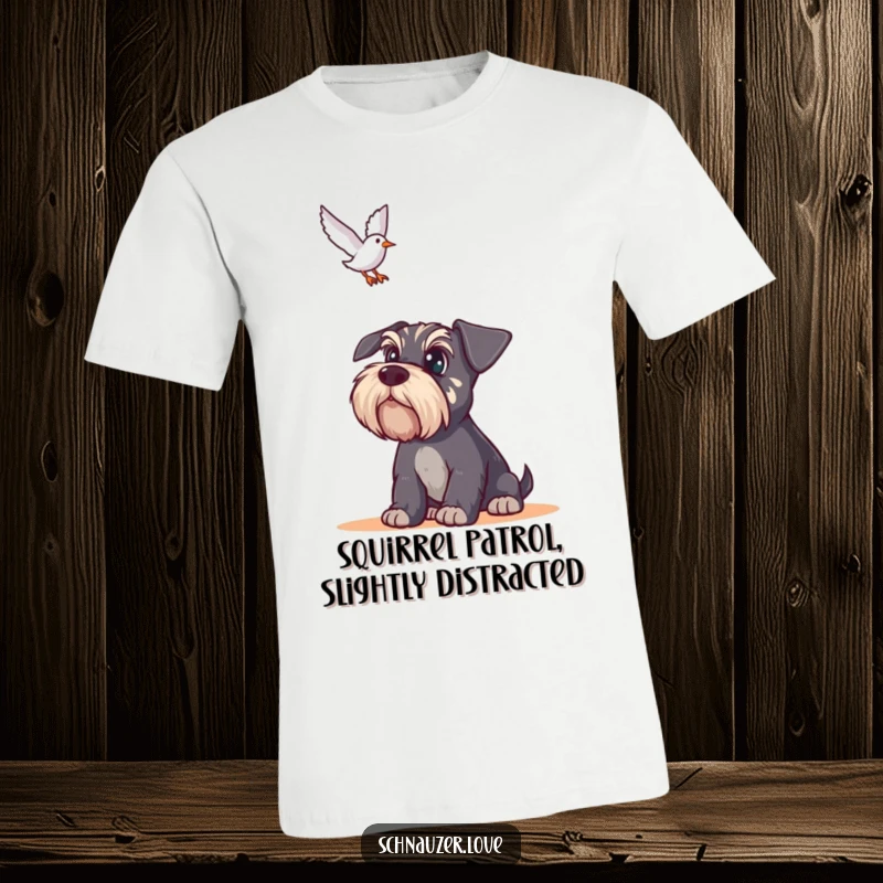 Funny Schnauzer T-Shirt: Wide-eyed schnauzer staring intently upwards at a bird in flight, capturing humorous vigilance.