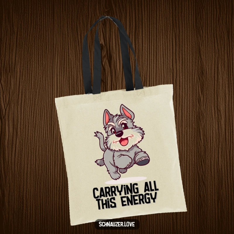 Funny Tote Bag showcasing a fluffy schnauzer joyfully chasing its tail, great for carrying essentials with canine charm.